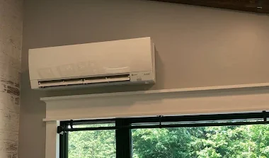 ductless air system on wall above big window