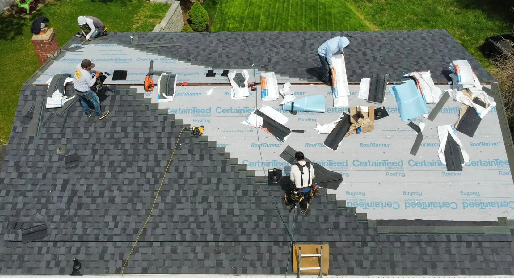 Schultheis Bros working on a residential roof